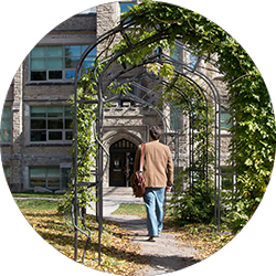 Jan Cami walking toward Physics Building